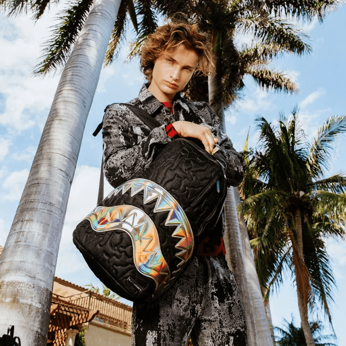 Black Quilted Irridescent DLXSV Backpack
